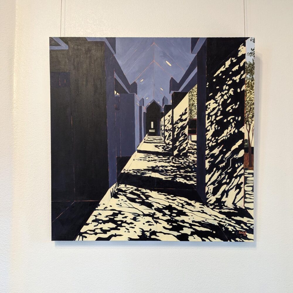 Breezeway - Acrylic Painting by Artist Leslie Deil. This painting interprets an outdoor walkway in San Antonio, TX. The interplay between light and shadow contrast against the geometric structural elements. This photo is the painting hung on a white gallery wall.