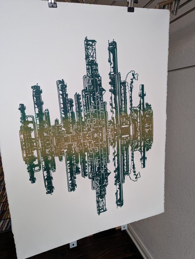 "Emerald City" linocut prints hanging up in the studio to dry.